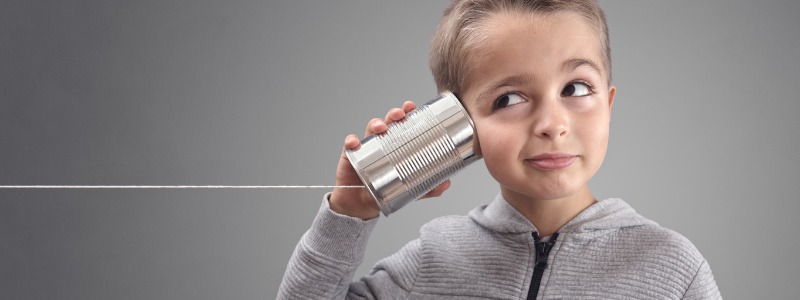 boy with a tin can phone