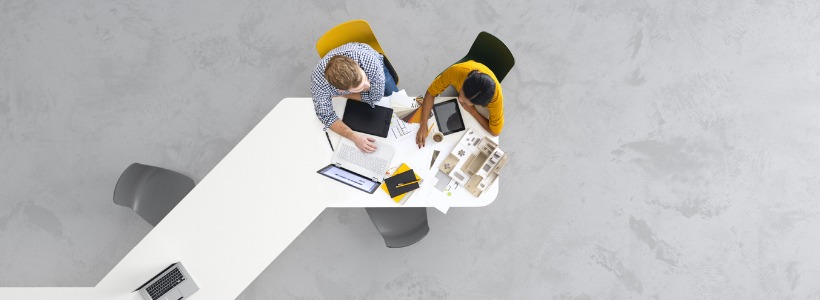 bird's eye view of architects at a desk | creative participation in meetings